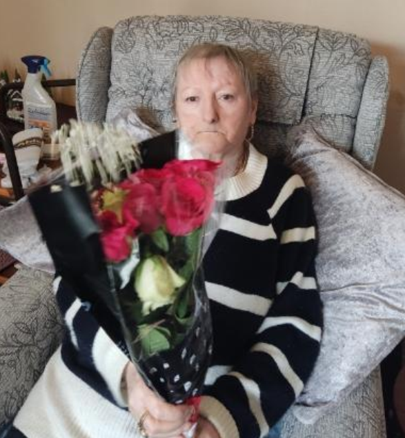 Mrs Heaney with her flowers from Ableworld Runcorn